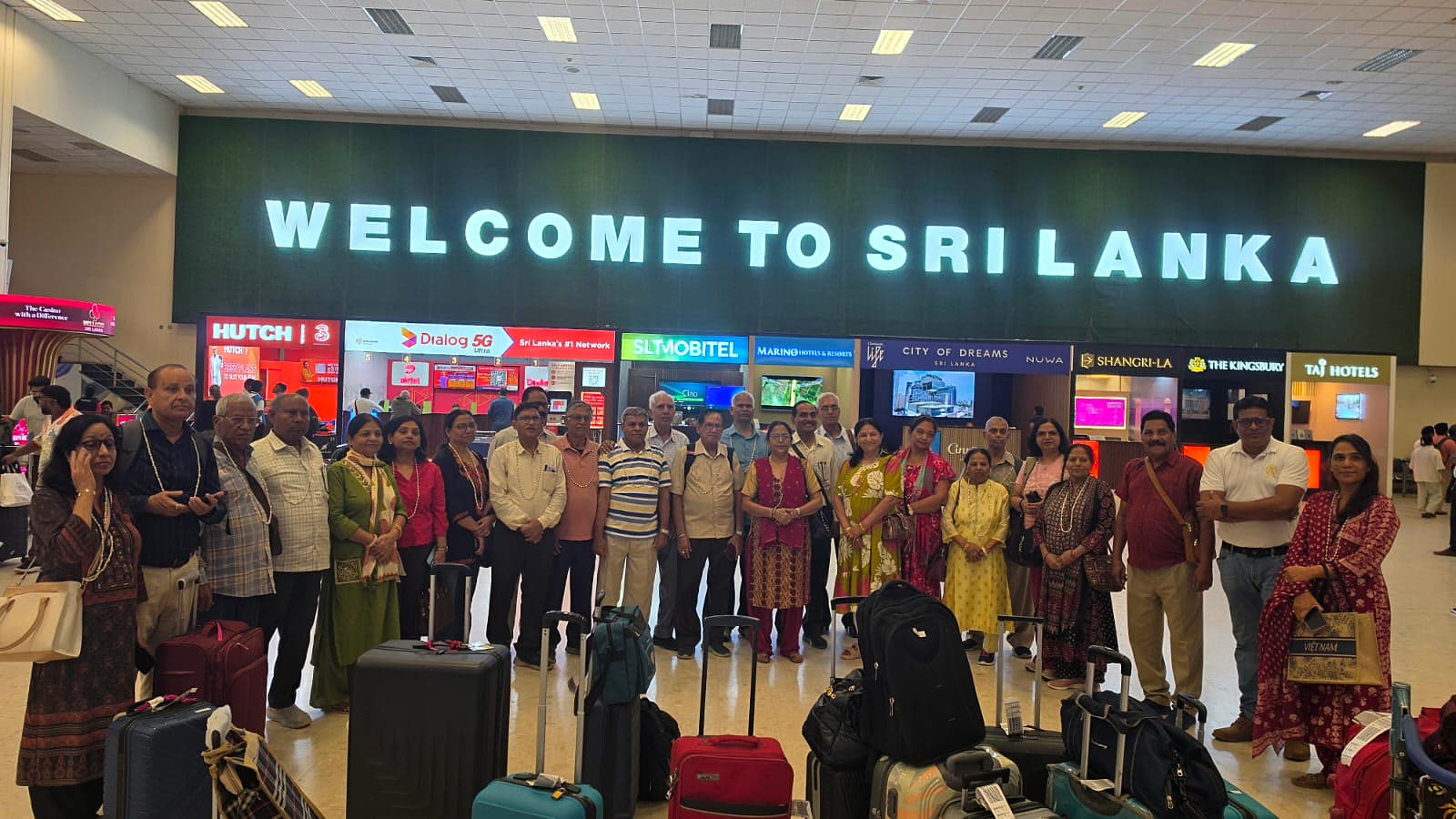 A tour group at Colombo airport arrivals