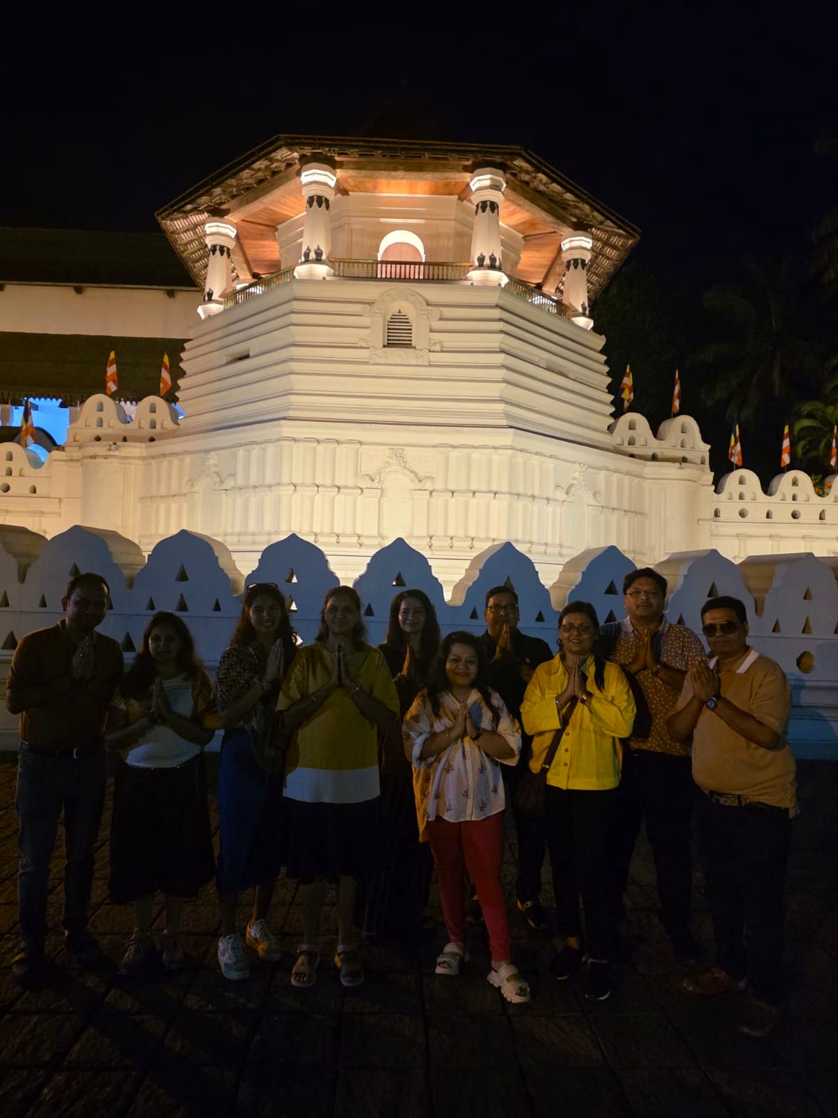 Group at the Temple of the Tooth at night